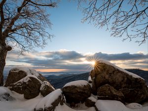 Preview wallpaper stones, sun, snow, winter, branches, nature