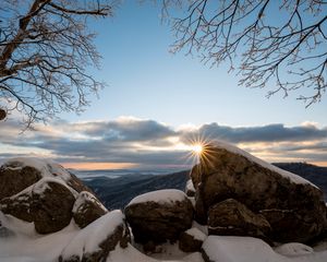 Preview wallpaper stones, sun, snow, winter, branches, nature