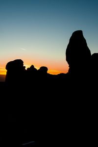 Preview wallpaper stones, sunset, silhouettes, utah, sky