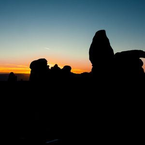 Preview wallpaper stones, sunset, silhouettes, utah, sky