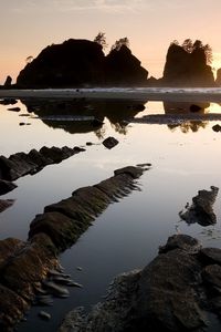 Preview wallpaper stones, water, clouds, sky, sun, horizon