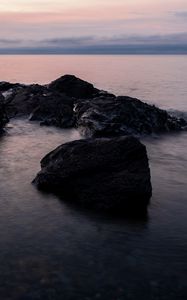 Preview wallpaper stones, water, sea, evening, horizon