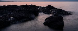 Preview wallpaper stones, water, sea, evening, horizon