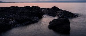 Preview wallpaper stones, water, sea, evening, horizon