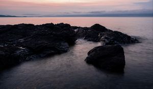 Preview wallpaper stones, water, sea, evening, horizon