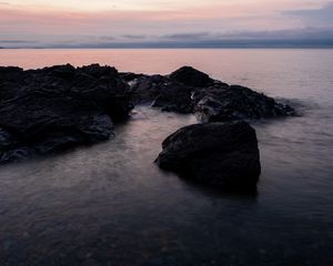 Preview wallpaper stones, water, sea, evening, horizon