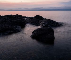 Preview wallpaper stones, water, sea, evening, horizon