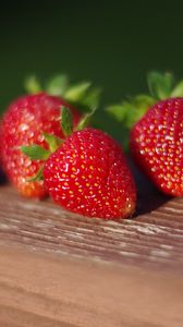 Preview wallpaper strawberries, berries, surface, macro