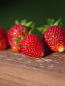 Preview wallpaper strawberries, berries, surface, macro