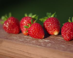 Preview wallpaper strawberries, berries, surface, macro