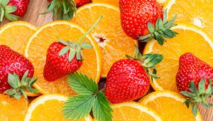 Preview wallpaper strawberries, orange, fruits, berry, slices