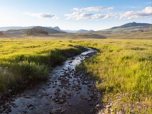 Preview wallpaper stream, field, mountains, horizon