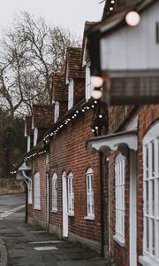 Preview wallpaper street, buildings, garlands, architecture, old, town