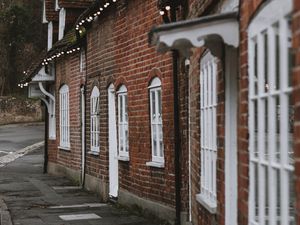 Preview wallpaper street, buildings, garlands, architecture, old, town