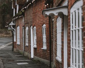 Preview wallpaper street, buildings, garlands, architecture, old, town