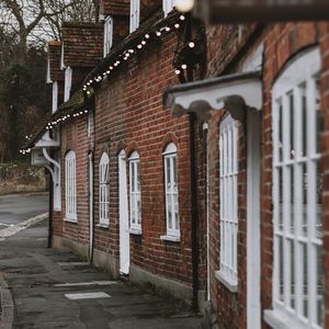 Preview wallpaper street, buildings, garlands, architecture, old, town