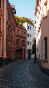 Preview wallpaper street, buildings, paving stones, architecture, flashlight