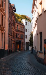 Preview wallpaper street, buildings, paving stones, architecture, flashlight