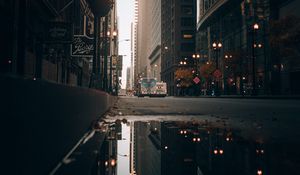 Preview wallpaper street, city, buildings, puddle, reflection