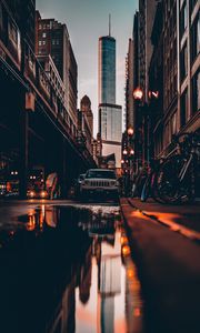 Preview wallpaper street, city, reflection, puddle, cars, buildings, bicycles