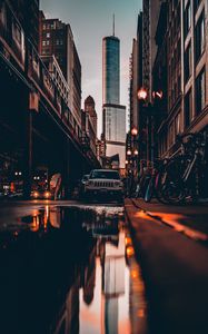 Preview wallpaper street, city, reflection, puddle, cars, buildings, bicycles