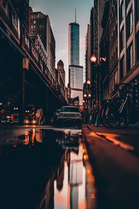 Preview wallpaper street, city, reflection, puddle, cars, buildings, bicycles