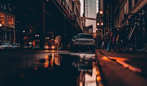 Preview wallpaper street, city, reflection, puddle, cars, buildings, bicycles