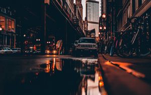 Preview wallpaper street, city, reflection, puddle, cars, buildings, bicycles