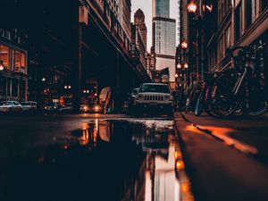 Preview wallpaper street, city, reflection, puddle, cars, buildings, bicycles