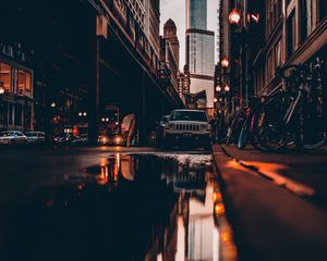 Preview wallpaper street, city, reflection, puddle, cars, buildings, bicycles