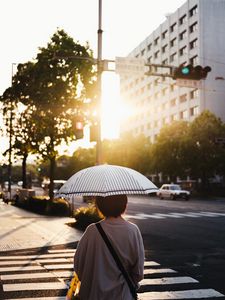 Preview wallpaper street, man, umbrella, sun, city