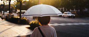 Preview wallpaper street, man, umbrella, sun, city