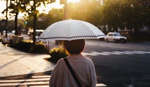 Preview wallpaper street, man, umbrella, sun, city