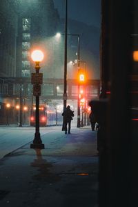 Preview wallpaper street, people, night, snow, city