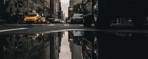 Preview wallpaper street, puddle, reflection, cars, buildings, asphalt