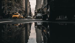Preview wallpaper street, puddle, reflection, cars, buildings, asphalt