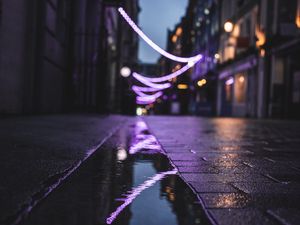 Preview wallpaper street, puddle, reflection, garlands, lights