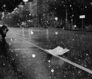 Preview wallpaper street, rain, bw, umbrella, asphalt, wet