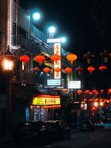 Preview wallpaper street, signs, night, cars, lanterns, dark