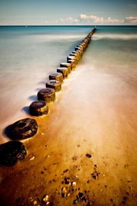 Preview wallpaper stubs, sand, coast, stones, water