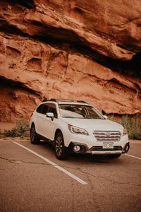 Preview wallpaper subaru, car, side view, white, rocks