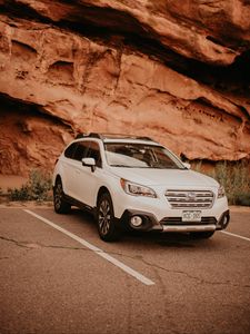 Preview wallpaper subaru, car, side view, white, rocks