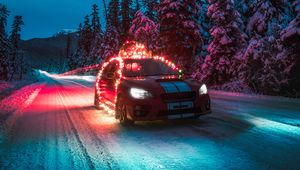 Preview wallpaper subaru sti, car, garlands, road, winter, night