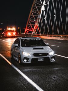 Preview wallpaper subaru wrx, subaru, car, sports car, front view, road, hieroglyphs