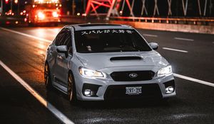 Preview wallpaper subaru wrx, subaru, car, sports car, front view, road, hieroglyphs