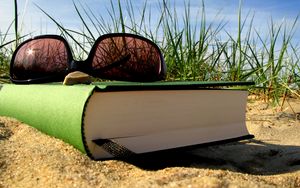 Preview wallpaper summer, vacation, book, glasses, bookmark, sand, grass