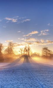 Preview wallpaper sun, beams, field, football, gate, hoarfrost, frosts