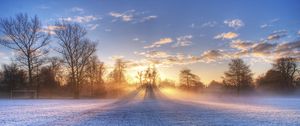 Preview wallpaper sun, beams, field, football, gate, hoarfrost, frosts