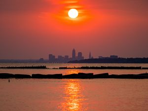 Preview wallpaper sun, buildings, silhouettes, water, sunset