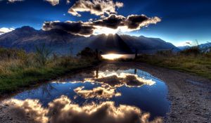 Preview wallpaper sun, clouds, lake, reflection, light, shadows, mountains, sky